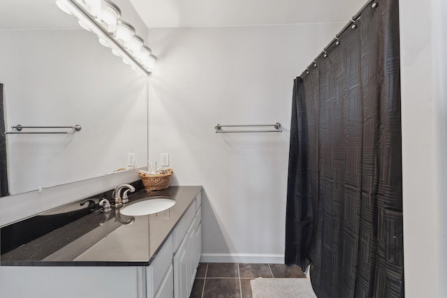 full bathroom with baseboards, a shower with shower curtain, vanity, and tile patterned floors