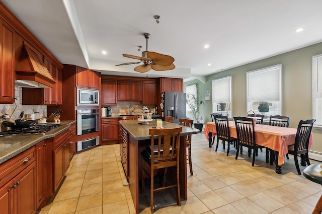 kitchen with custom exhaust hood, tasteful backsplash, a warming drawer, appliances with stainless steel finishes, and recessed lighting