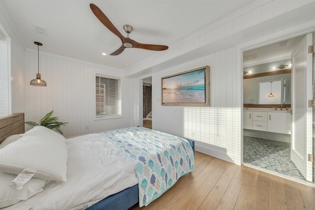 101 Harvard Ave, Cape May Point, NJ 08212 - bedroom featuring a ceiling fan, visible vents, ornamental molding, a sink, and light wood-style floors