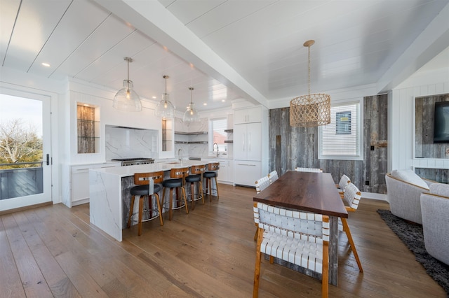 101 Harvard Ave, Cape May Point, NJ 08212 - dining room with a notable chandelier, beamed ceiling, and dark wood finished floors