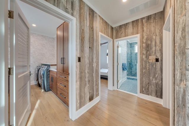 101 Harvard Ave, Cape May Point, NJ 08212 - hallway with visible vents, separate washer and dryer, wooden walls, light wood finished floors, and baseboards