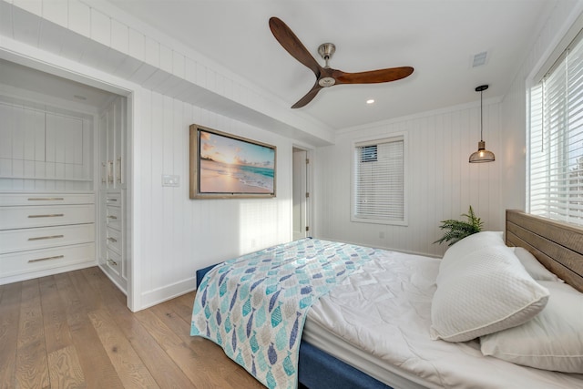 101 Harvard Ave, Cape May Point, NJ 08212 - bedroom with baseboards, visible vents, ornamental molding, ceiling fan, and wood-type flooring