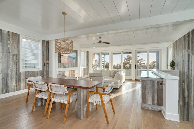 101 Harvard Ave, Cape May Point, NJ 08212 - dining space featuring light wood finished floors, baseboards, beamed ceiling, ceiling fan with notable chandelier, and wooden ceiling