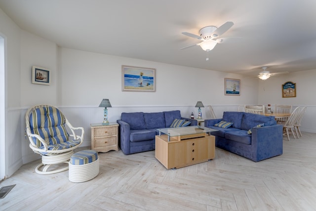 324 E 23rd Ave Unit A, North Wildwood, NJ 08260 - living area featuring ceiling fan and wainscoting