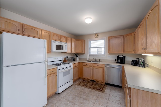 324 E 23rd Ave Unit A, North Wildwood, NJ 08260 - kitchen featuring white appliances, light brown cabinets, a sink, and light countertops