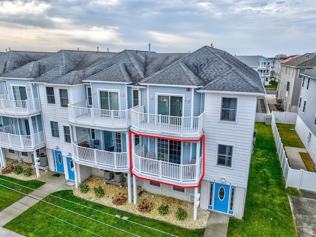 324 E 23rd Ave Unit A, North Wildwood, NJ 08260 - view of building exterior with a fenced backyard and central AC