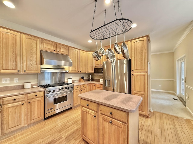 kitchen featuring under cabinet range hood, appliances with stainless steel finishes, crown molding, and light brown cabinetry