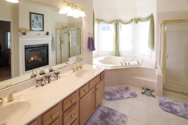 bathroom featuring tile patterned floors, shower with separate bathtub, and vanity