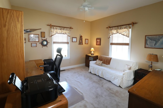 office with ceiling fan, plenty of natural light, and carpet floors