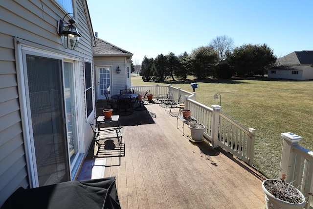 wooden terrace with a yard