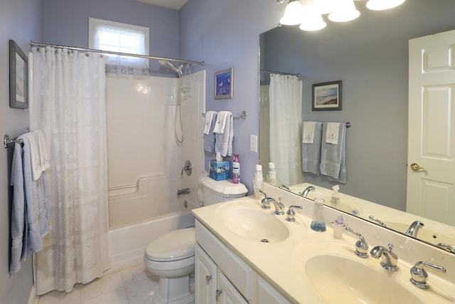 full bathroom featuring toilet, vanity, tile patterned floors, and shower / bath combo with shower curtain