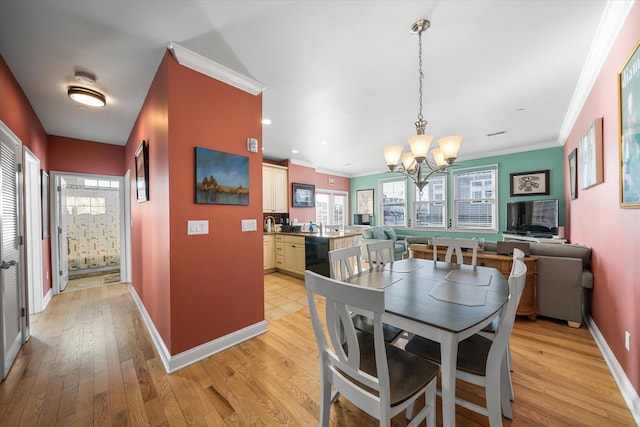 3814 Landis Ave Unit 1, Sea Isle City, NJ 08243 - dining area featuring ornamental molding, plenty of natural light, and light hardwood / wood-style floors