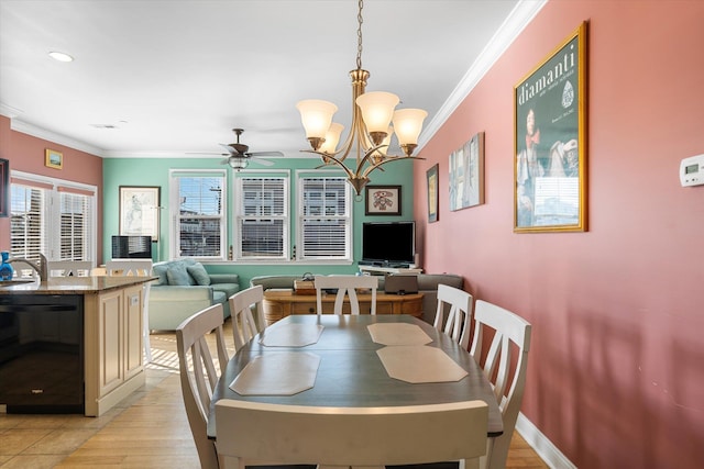 3814 Landis Ave Unit 1, Sea Isle City, NJ 08243 - dining space featuring ceiling fan with notable chandelier, ornamental molding, and light hardwood / wood-style floors