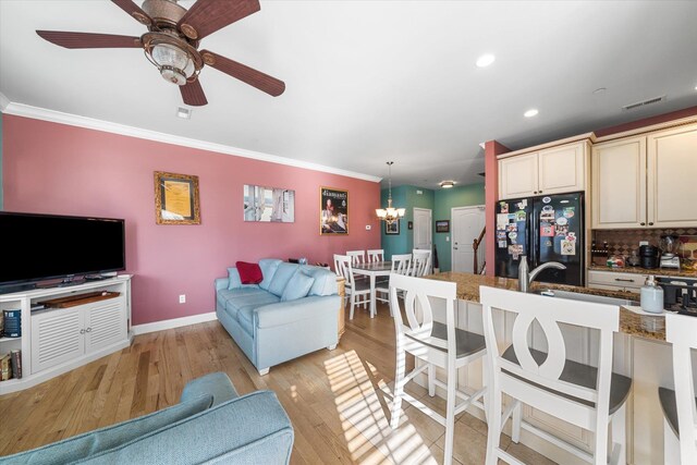 3814 Landis Ave Unit 1, Sea Isle City, NJ 08243 - interior space with crown molding, sink, ceiling fan with notable chandelier, and light hardwood / wood-style flooring
