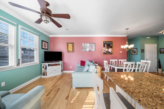 3814 Landis Ave Unit 1, Sea Isle City, NJ 08243 - living room featuring ceiling fan with notable chandelier, crown molding, and light hardwood / wood-style floors