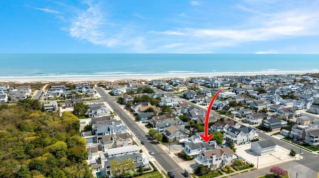 255 117th St Unit 2, Stone Harbor, NJ 08247 - drone / aerial view featuring a water view, a residential view, and a view of the beach