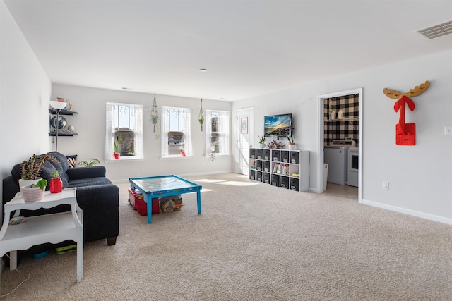 game room with carpet flooring and washer and clothes dryer