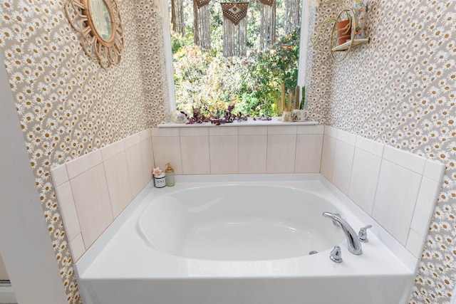 bathroom with a tub to relax in