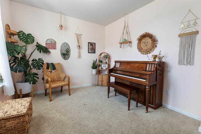 living area featuring light carpet