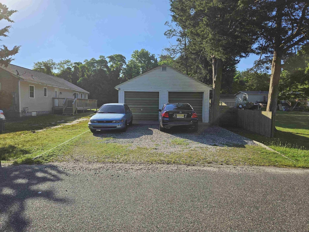 garage featuring a lawn