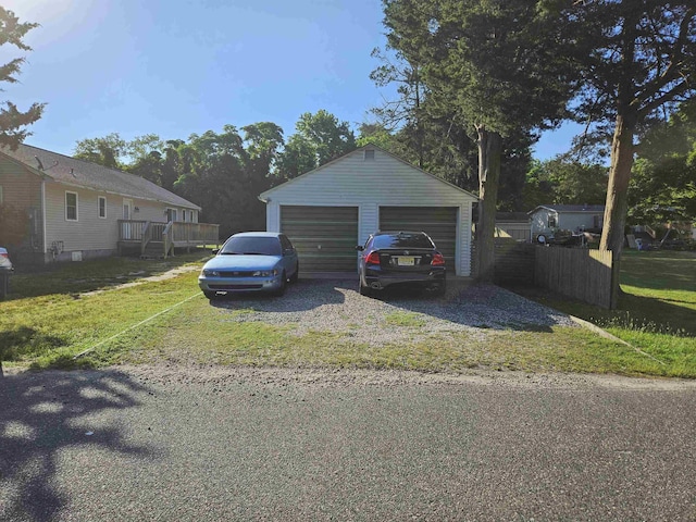 garage featuring a lawn