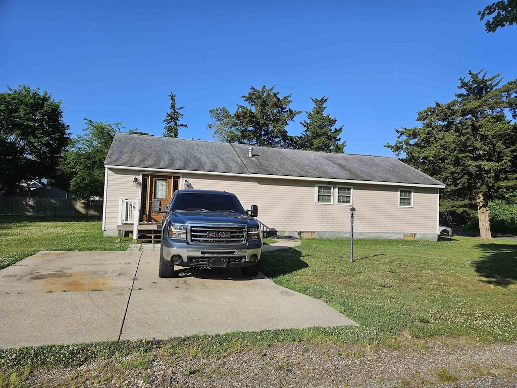 view of home's exterior with a yard