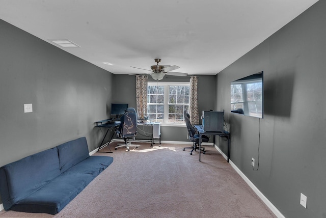 office featuring baseboards, plenty of natural light, a ceiling fan, and carpet flooring