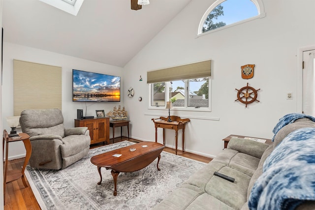 117 W Drumbed Rd, Villas, NJ 08251 - living room with high vaulted ceiling, wood finished floors, a skylight, and a ceiling fan