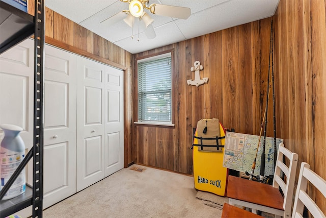 117 W Drumbed Rd, Villas, NJ 08251 - carpeted bedroom with wooden walls, a closet, and ceiling fan