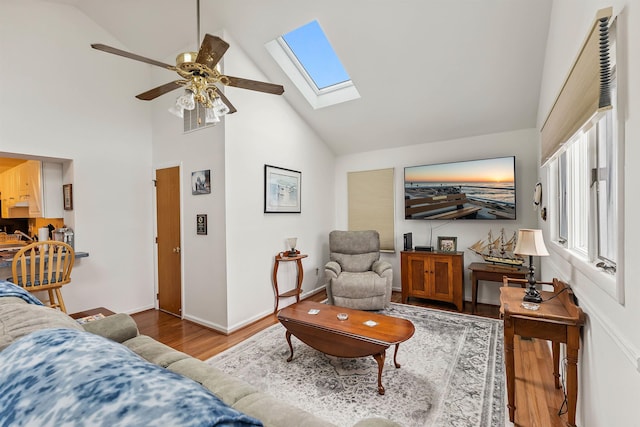 117 W Drumbed Rd, Villas, NJ 08251 - living room with wood finished floors, a skylight, high vaulted ceiling, and ceiling fan