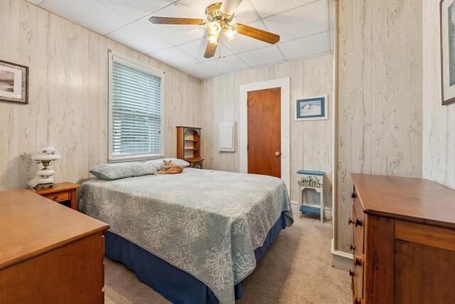 117 W Drumbed Rd, Villas, NJ 08251 - bedroom featuring light colored carpet, a drop ceiling, a ceiling fan, and wood walls