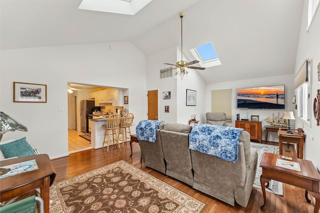 117 W Drumbed Rd, Villas, NJ 08251 - living room with a skylight, ceiling fan, high vaulted ceiling, and light wood-type flooring
