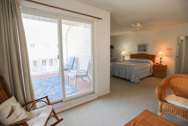 bedroom with multiple windows, ceiling fan, and access to outside