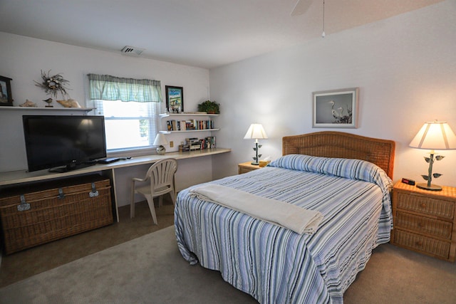 bedroom with ceiling fan and carpet