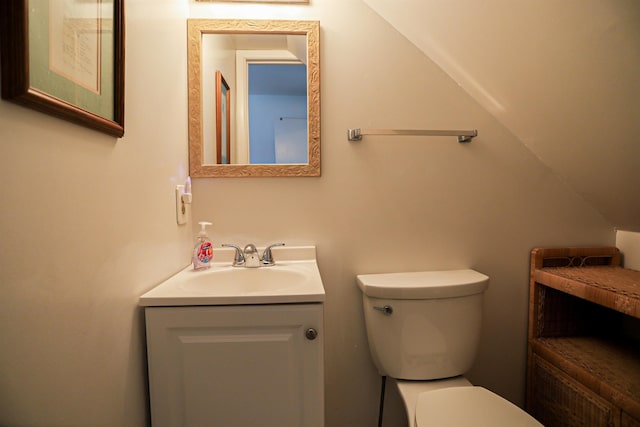 bathroom with toilet and vanity