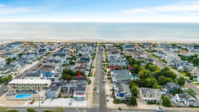 bird's eye view with a water view and a view of the beach