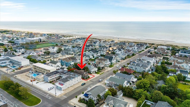 drone / aerial view with a view of the beach and a water view