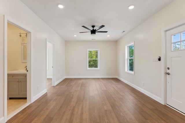 foyer entrance with visible vents, wood finished floors, baseboards, recessed lighting, and a ceiling fan