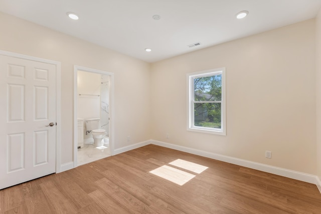 unfurnished bedroom featuring recessed lighting, baseboards, and light wood-style floors