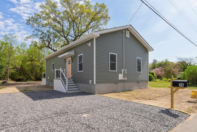 manufactured / mobile home featuring crawl space and driveway