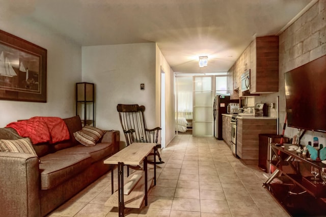 kitchen with appliances with stainless steel finishes and light tile patterned floors