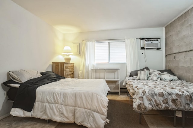 bedroom featuring a wall mounted AC