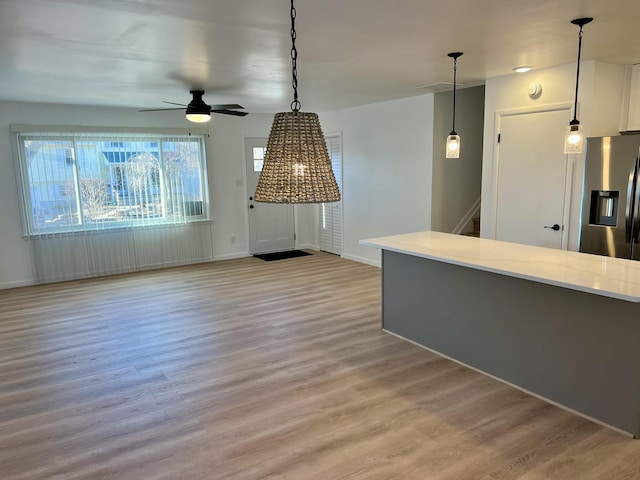 interior space featuring ceiling fan and light hardwood / wood-style floors