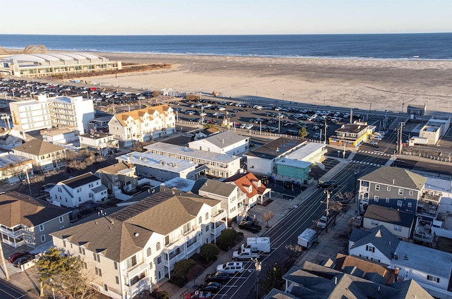 aerial view with a water view and a view of the beach