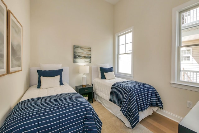 bedroom featuring baseboards