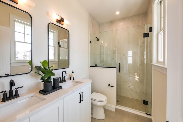 full bathroom with a sink, toilet, and a shower stall