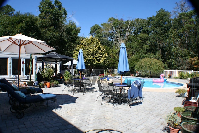 view of patio / terrace featuring a fenced in pool