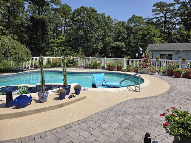 view of swimming pool featuring a patio