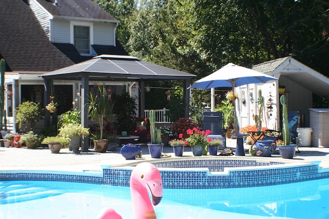 view of pool with a gazebo and a patio