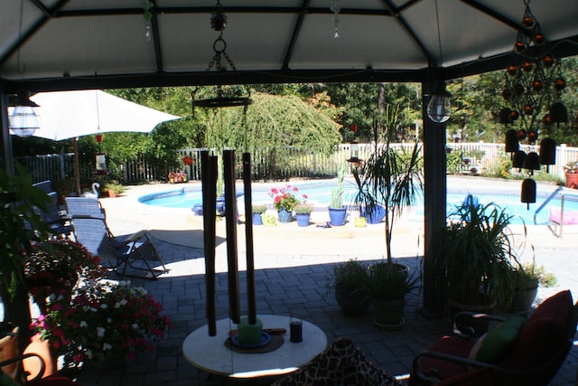 view of pool featuring a gazebo and a patio area